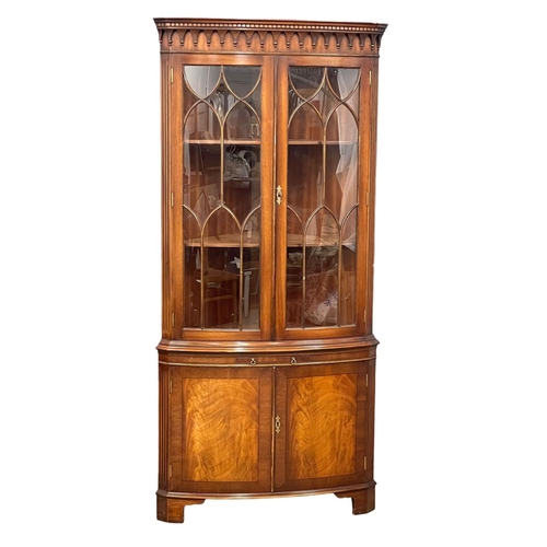 253 - A large Georgian style mahogany corner cabinet with brushing slide. 89x188cm