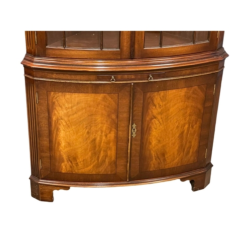 253 - A large Georgian style mahogany corner cabinet with brushing slide. 89x188cm