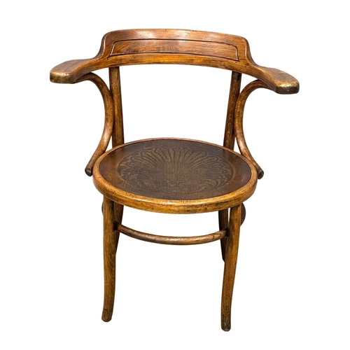 30 - An early 20th century Bentwood armchair by Thonet.