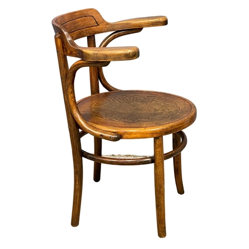 30 - An early 20th century Bentwood armchair by Thonet.