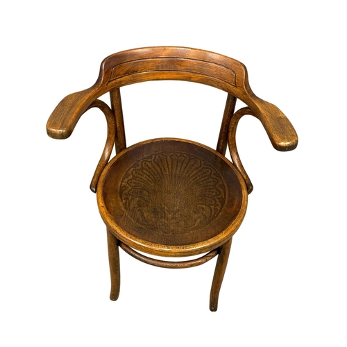 30 - An early 20th century Bentwood armchair by Thonet.