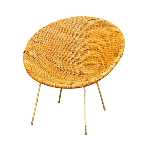 32 - A 1960’s Mid Century wicker bucket chair.