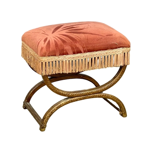 33 - An early 20th century x-framed footstool