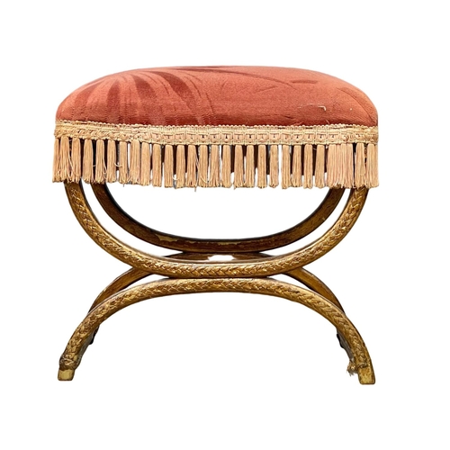 33 - An early 20th century x-framed footstool