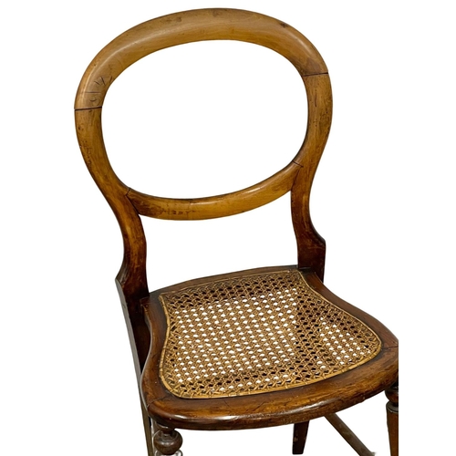 389 - A Victorian balloon back side chair with bergere seat and a small vintage oak Barley Twist table.