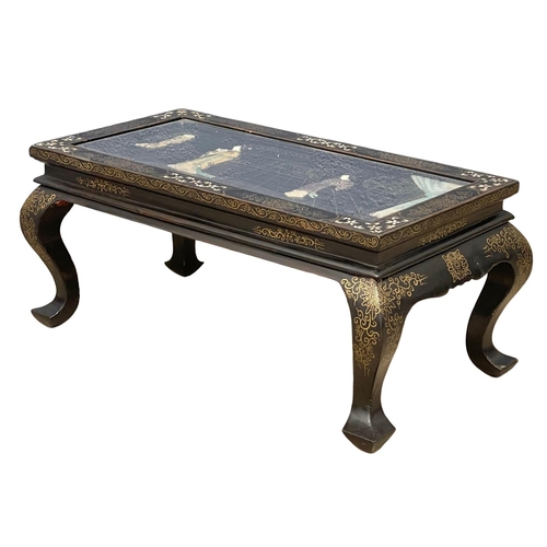 43 - A Japanese style glass top coffee table with Mother of Pearl and hand painted inlay. 72.5x38x32cm