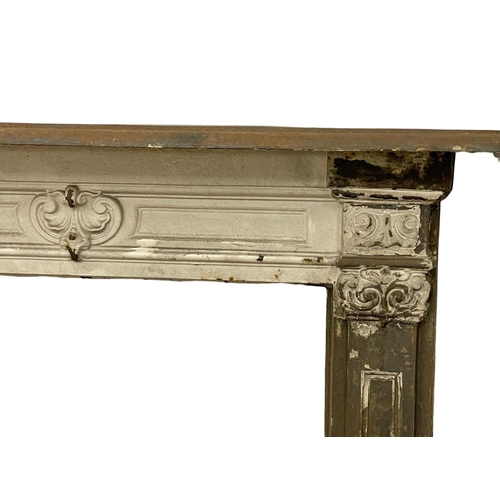 521E - A 19th century ornate cast iron fire surround.  112x15x113cm