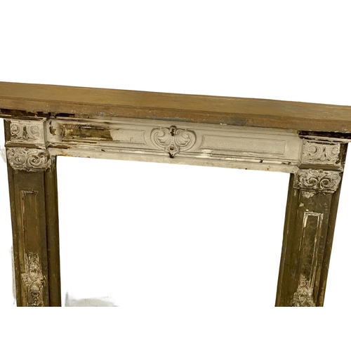 521E - A 19th century ornate cast iron fire surround.  112x15x113cm