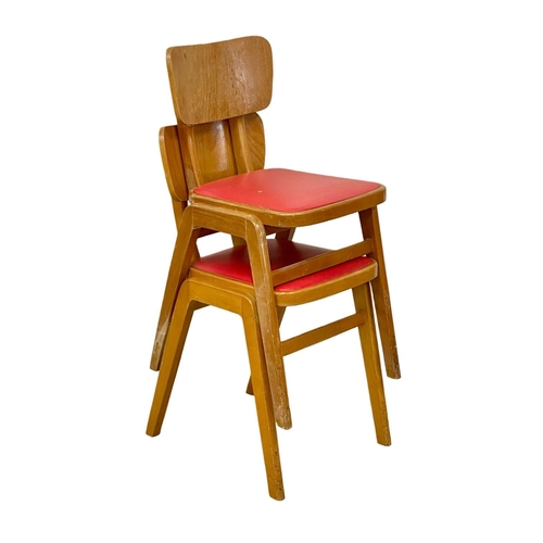 88 - A pair of vintage beech stacking chairs with vinyl seats