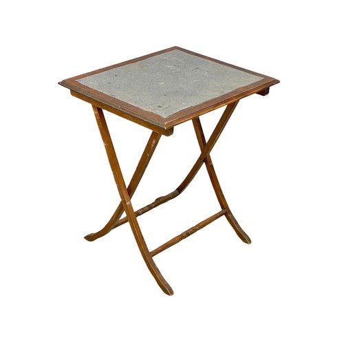 258 - An Edwardian mahogany folding games table. 60x51x68cm