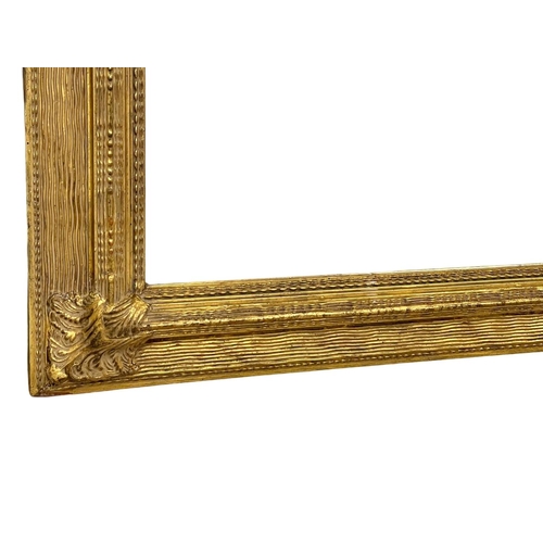 1624 - Large ornate gilt framed bevelled mirros, 140x110cm