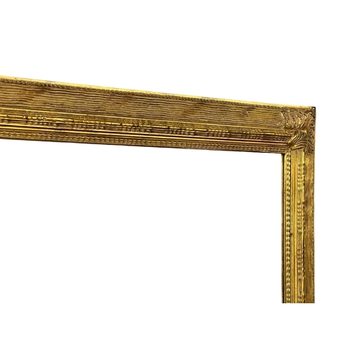 1624 - Large ornate gilt framed bevelled mirros, 140x110cm