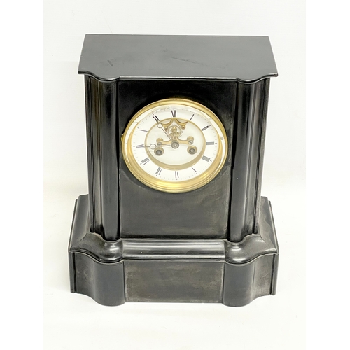 1 - A Victorian slate mantle clock with key and pendulum. 28x17x32.5cm