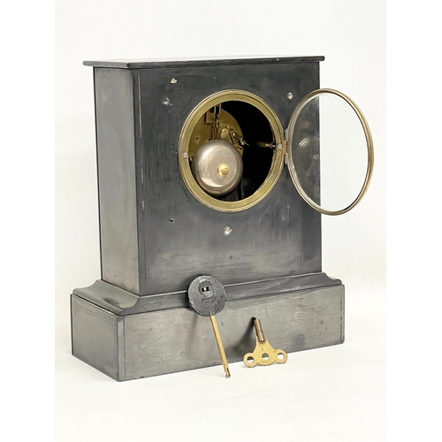 1 - A Victorian slate mantle clock with key and pendulum. 28x17x32.5cm