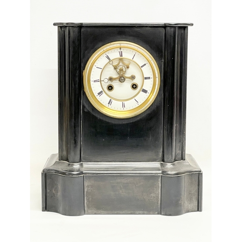 1 - A Victorian slate mantle clock with key and pendulum. 28x17x32.5cm