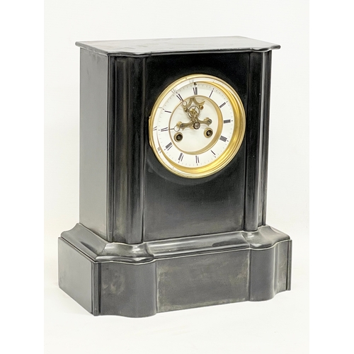 1 - A Victorian slate mantle clock with key and pendulum. 28x17x32.5cm