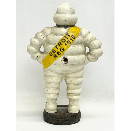 132 - A large cast iron Michelin Man advertising figure. 39.5cm