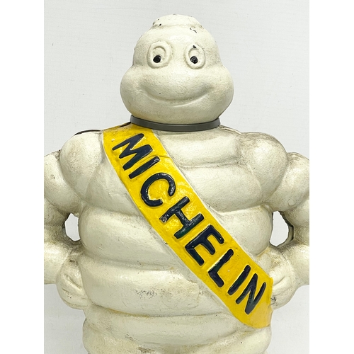 132 - A large cast iron Michelin Man advertising figure. 39.5cm