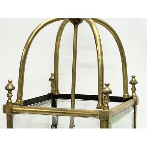 5 - A large late 19th/ early 20th century heavy brass electrified lantern with bevelled glass panels. 27... 