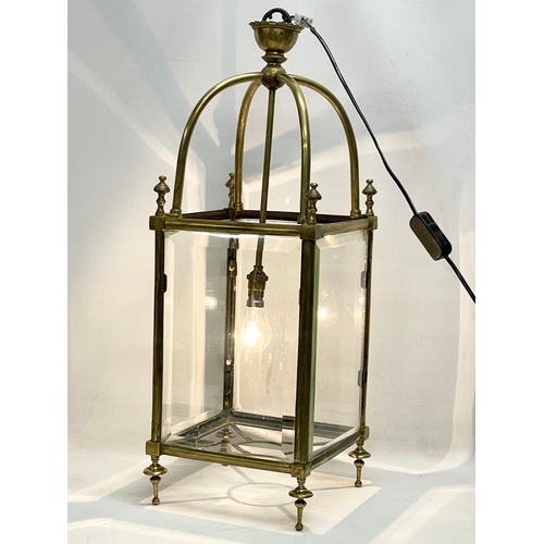 5 - A large late 19th/ early 20th century heavy brass electrified lantern with bevelled glass panels. 27... 