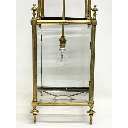 5 - A large late 19th/ early 20th century heavy brass electrified lantern with bevelled glass panels. 27... 