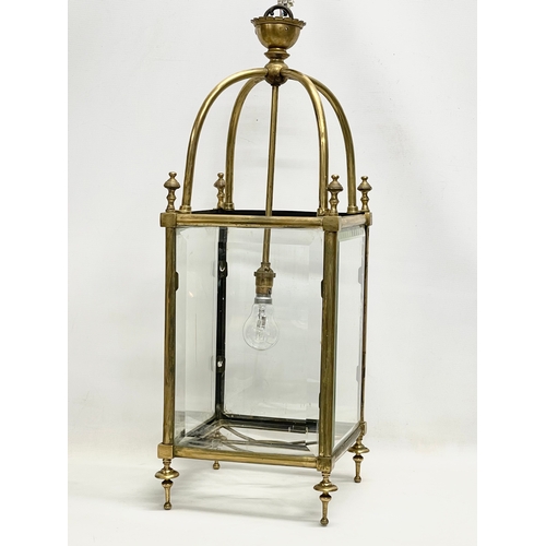 5 - A large late 19th/ early 20th century heavy brass electrified lantern with bevelled glass panels. 27... 