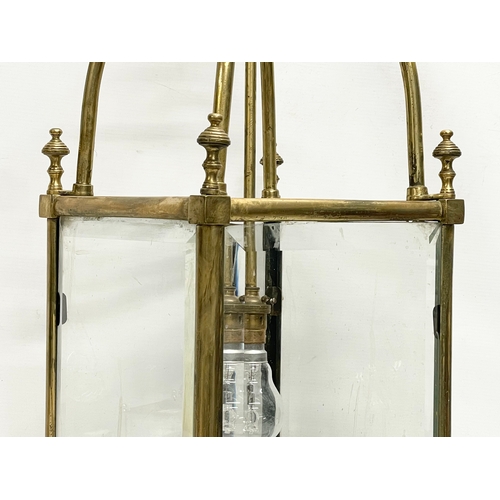 5 - A large late 19th/ early 20th century heavy brass electrified lantern with bevelled glass panels. 27... 