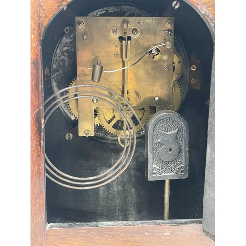 9 - A large Edwardian inlaid mahogany mantle clock with key and pendulum. 21.5x13x30.5cm