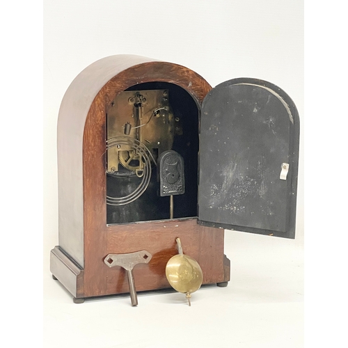 9 - A large Edwardian inlaid mahogany mantle clock with key and pendulum. 21.5x13x30.5cm