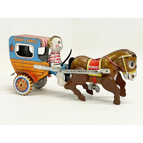 142 - A vintage Japanese tin plate windup ‘Mechanical Donkey Express’ toy in original box. Toy measures 17... 