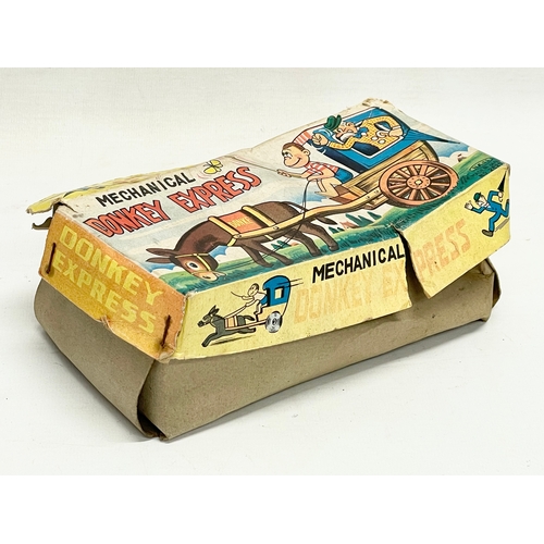 142 - A vintage Japanese tin plate windup ‘Mechanical Donkey Express’ toy in original box. Toy measures 17... 