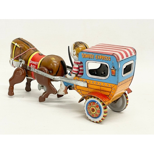 142 - A vintage Japanese tin plate windup ‘Mechanical Donkey Express’ toy in original box. Toy measures 17... 