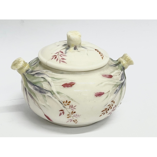 849 - A 1st period Belleek Pottery Grass Pattern sugar bowl with lid and a 2nd period Belleek Pottery jug.... 