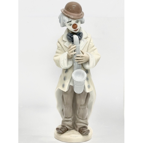 854 - A Lladro figurine ‘Sad Sax’ 23cm.