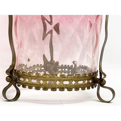 13 - A large late Victorian Cranberry Glass shade in ornate brass frame. 25x26.5cm.