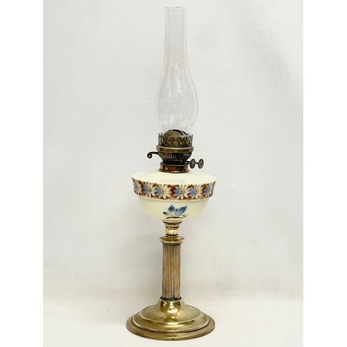 37 - A Victorian double burner oil lamp. 65cm