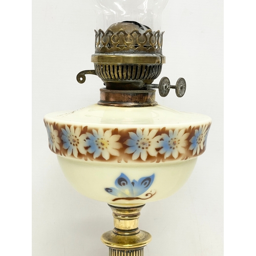 37 - A Victorian double burner oil lamp. 65cm