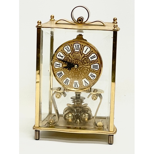 43 - A vintage brass German mantle clock by Keninger & Obergfell. 14x11x22cm.