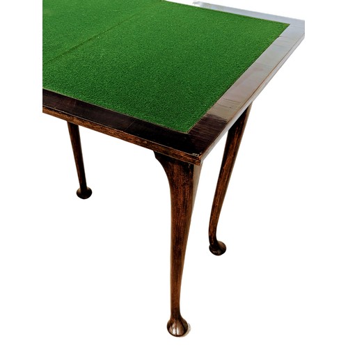 1623 - An early 20th century mahogany games table on Cabriole legs, 61cm x 38cm x 76cm