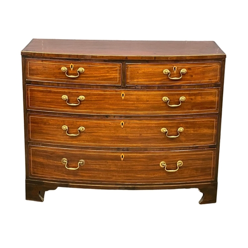 1621 - A George III inlaid mahogany bow front chest of drawers with brass drop handles. Circa 1790-1800. Wi... 