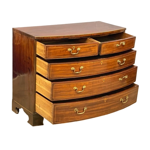 1621 - A George III inlaid mahogany bow front chest of drawers with brass drop handles. Circa 1790-1800. Wi... 