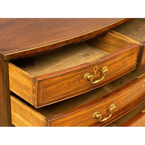 1621 - A George III inlaid mahogany bow front chest of drawers with brass drop handles. Circa 1790-1800. Wi... 