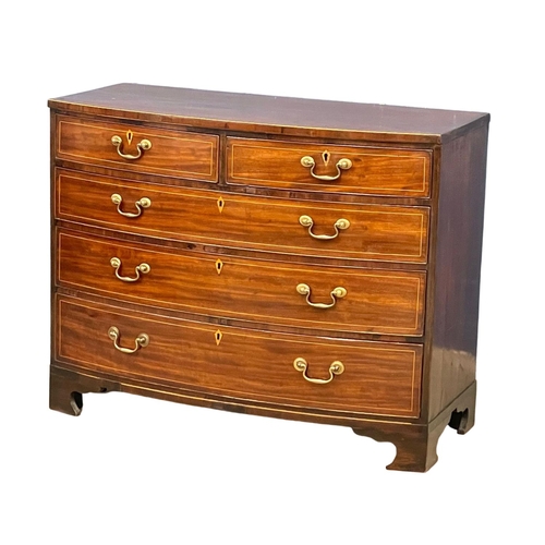 1621 - A George III inlaid mahogany bow front chest of drawers with brass drop handles. Circa 1790-1800. Wi... 