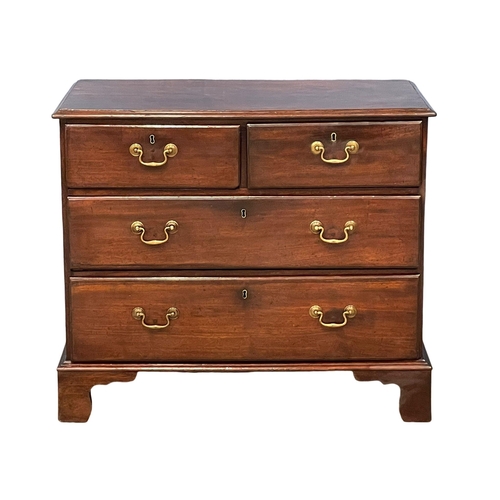 1619 - A fine proportioned George III mahogany chest of drawers with brass drop handles on bracket feet. Ci... 