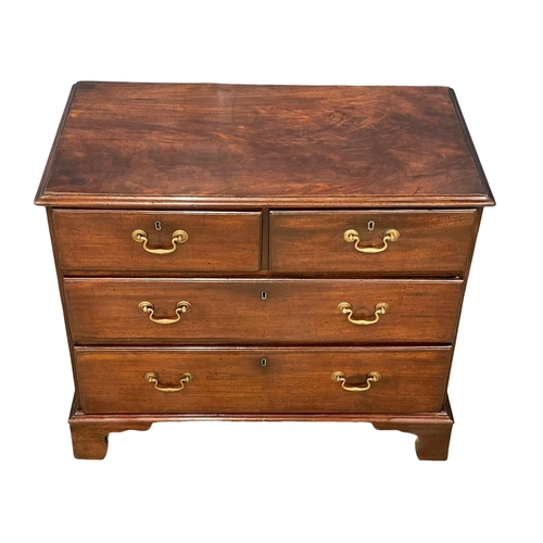 1619 - A fine proportioned George III mahogany chest of drawers with brass drop handles on bracket feet. Ci... 