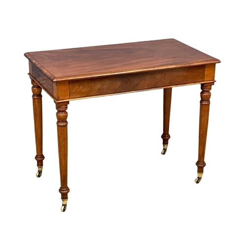 1617 - A Victorian mahogany side table by Loach & Clarke, on brass cup casters. 94x55x74cm