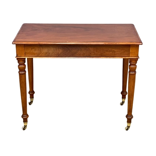 1617 - A Victorian mahogany side table by Loach & Clarke, on brass cup casters. 94x55x74cm