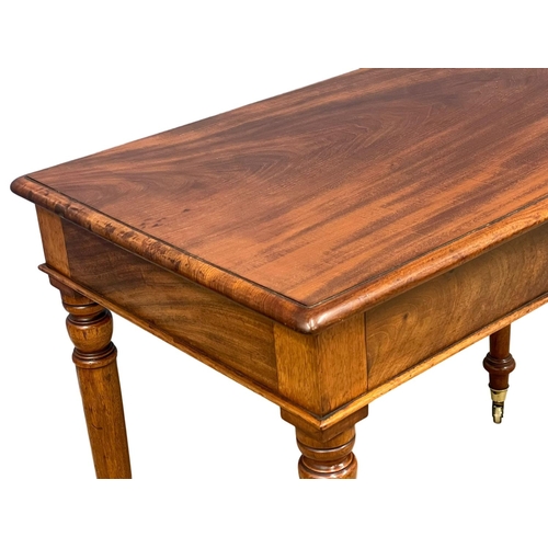 1617 - A Victorian mahogany side table by Loach & Clarke, on brass cup casters. 94x55x74cm