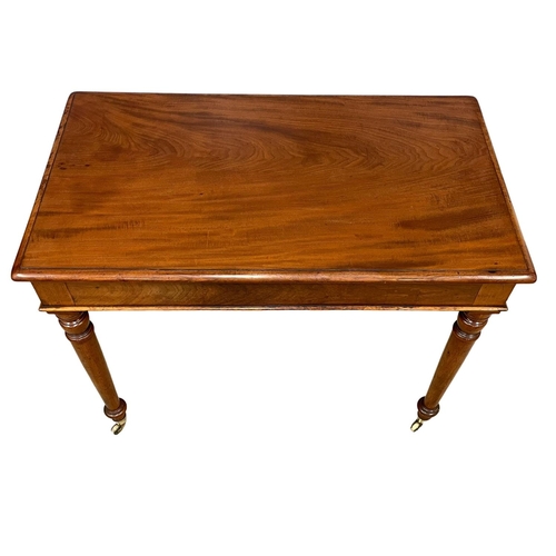 1617 - A Victorian mahogany side table by Loach & Clarke, on brass cup casters. 94x55x74cm