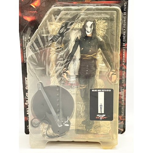 151 - 3 unopened action figures. A McFarlane Toys 12” Collectibles ‘The Crow’ action figure in box. A McFa... 